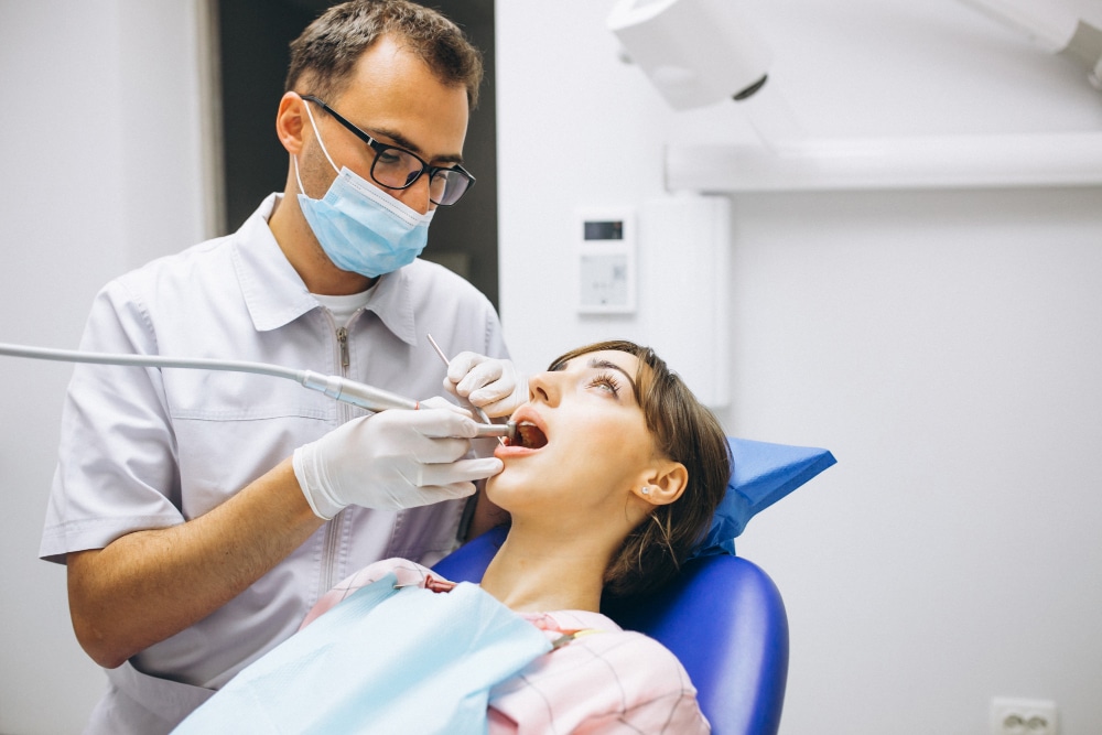 Dentist examining a patient during preventive dental care