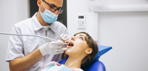 Dentist examining a patient during preventive dental care